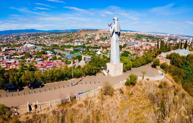 Kartlis Deda or Mother of Georgia monument aerial panoramic view in Tbilisi old town. Tbilisi is the capital and the largest city of Georgia.