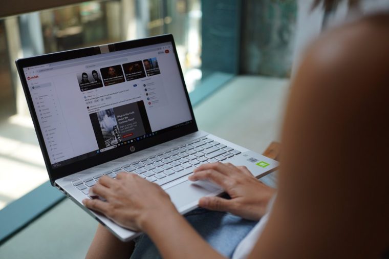 CHINA - 2024/09/03: In this photo illustration, a woman browses Reddit website on her laptop. (Photo Illustration by Serene Lee/SOPA Images/LightRocket via Getty Images)