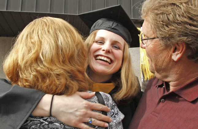 2F0B91F Jeanna Giese is all smiles as she is embraced by her parents Anne and John Giese, right, following graduation from Lakeland College in Sheboygan, Wisconsin, May 8, 2011. In 2005 Jeanna could barely walk, taking her first steps alone into the arms of her father while recovering from rabies. She made medical history becoming the first human to survive rabies without vaccine after a bat bit her in church. (Photo by Rick Wood/Milwaukee Journal Sentinel/MCT/Sipa USA)