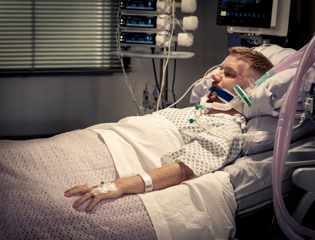 Gary Windass lies unconscious in a hospital bed in Coronation Street