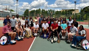 The group of Alabama students with several wheelchair basketball players