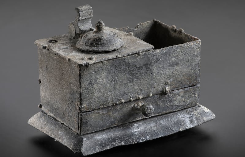 A pewter writing set/ ink well which was recovered from the Rooswijk shipwreck