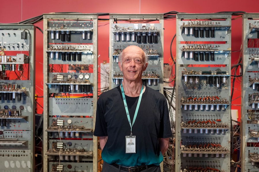 Volunteer Eric Wright in front of ‘Baby’ the Manchester Small-Scale Experimental Machine aka the world's first computer