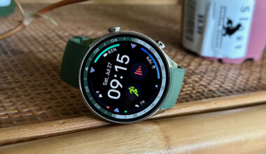 The OnePlus Watch 2R sitting on a shelf, showing a sporty watch face.