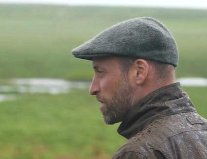 Prince William wears a traditional flatcap with a waterproof coat on a visit to Dartmoor