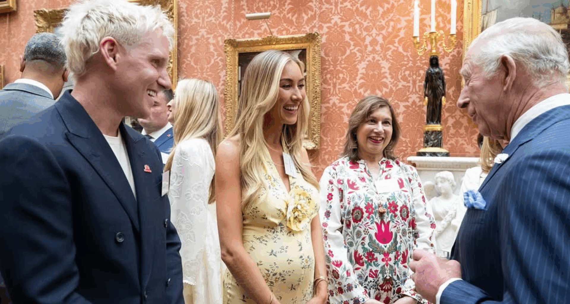 Jamie Laing and Sophie Habboo talking to King Charles at Buckingham Palace