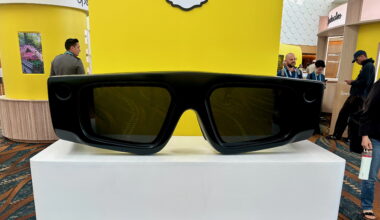A giant-sized pair of Snap Spectacles AR glasses facing the photographer, on a podium on the AWE 2025 show floor.