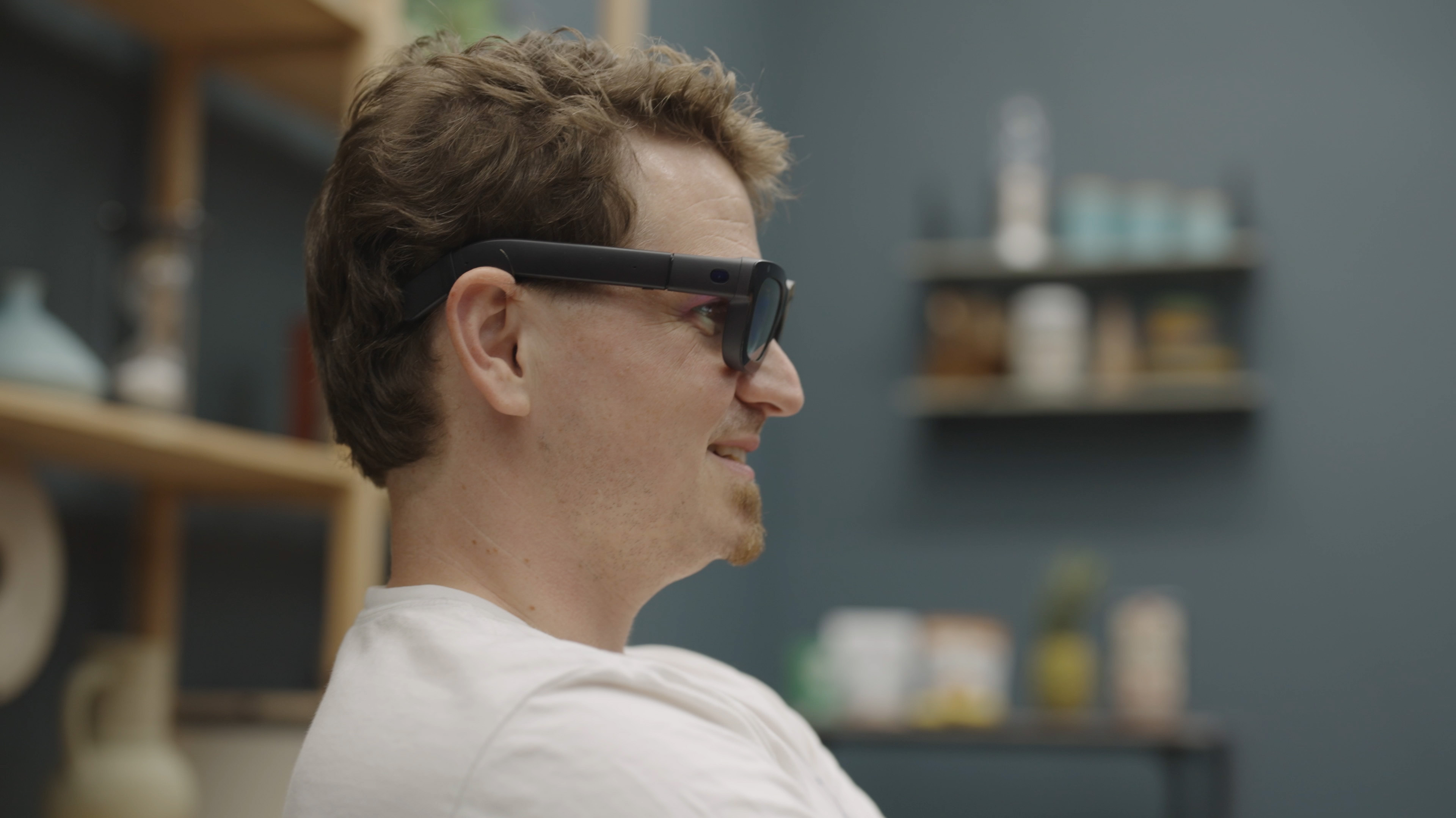 Photo of Nick Sutrich wearing and using the Meta Orion AR glasses