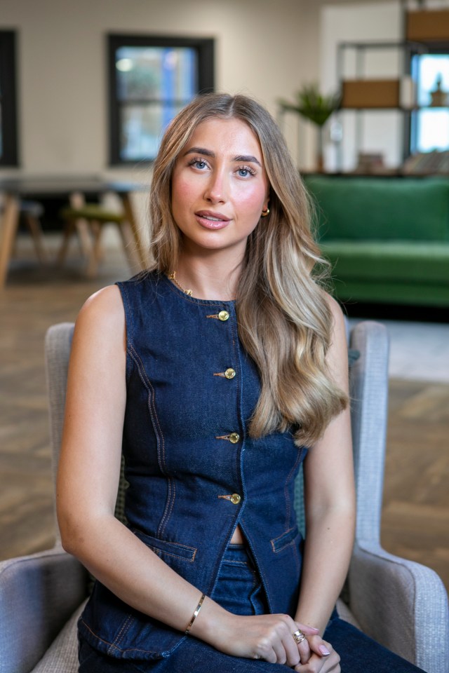 Portrait of Lily Phillips in a denim vest.