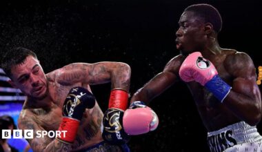 Richardson Hitchins throws a punch at George Kambosos Jr during their fight in June 2025