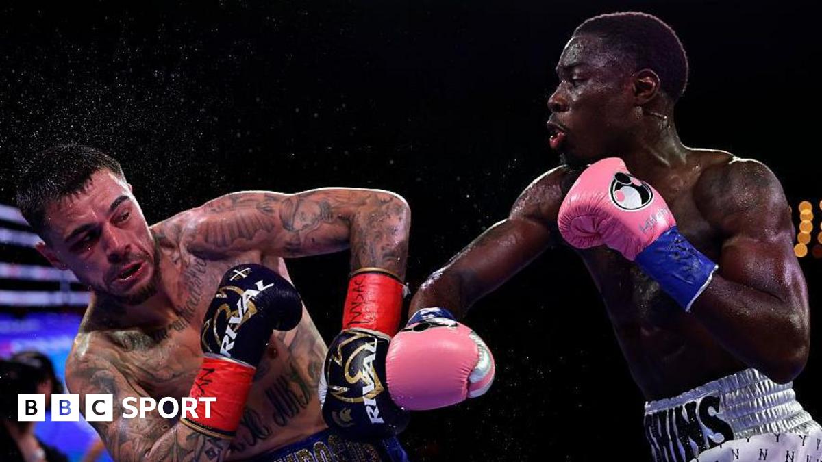Richardson Hitchins throws a punch at George Kambosos Jr during their fight in June 2025
