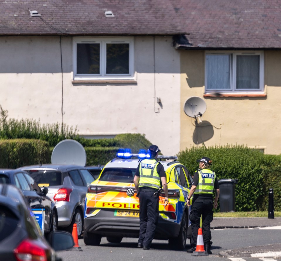 Police officers at a crime scene.