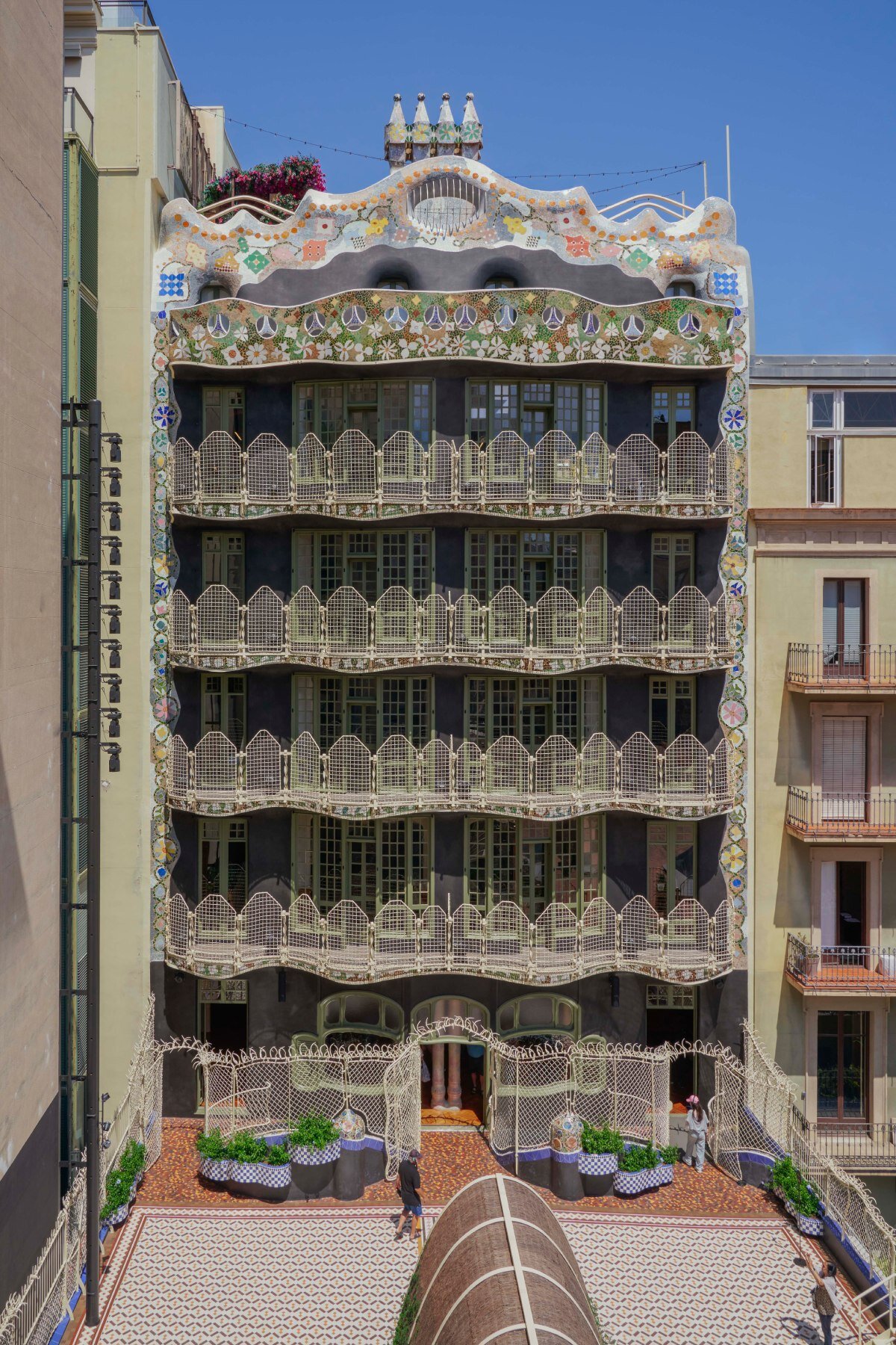 mosaics, ironwork, and pergolas of gaudí's casa batlló in barcelona restored after a century