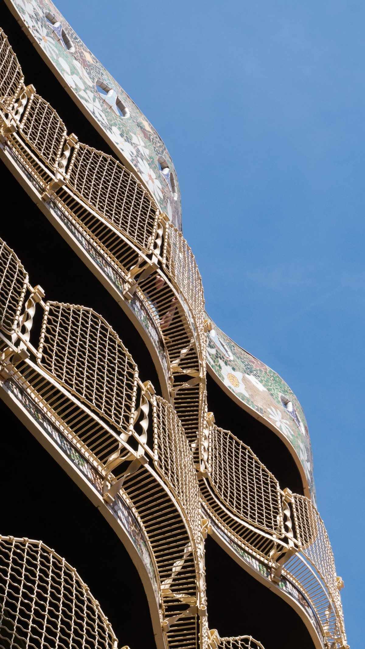 mosaics, ironwork, and pergolas of gaudí's casa batlló in barcelona restored after a century