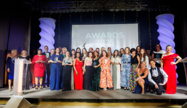 Siobhan Rowland and Hester Maclean of Edwards Wealth present the Excellence In Health & Wellbeing Award to Doreth Abrahams