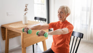 a photo of a senior woman doing exercises in a chair