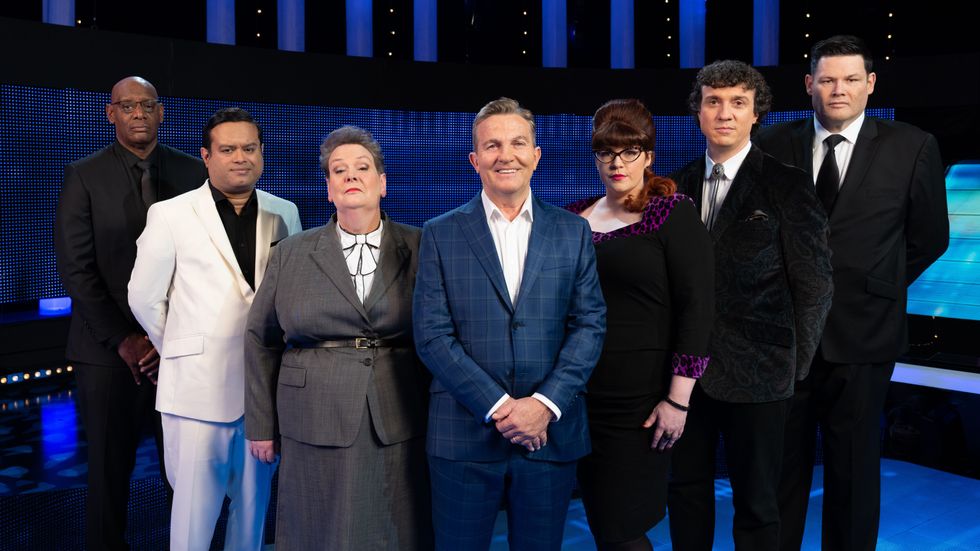 Bradley Walsh pictured in front of The Chasers in a promotional image for the ITV Quiz show
