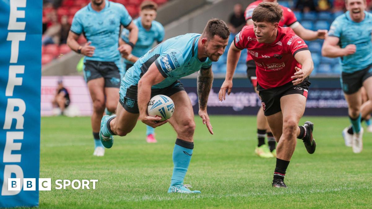 Cade Cust dives over for a try near the posts for Hull FC