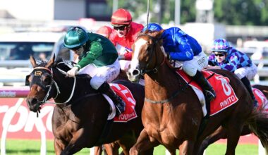 The Glen Thompson-trained filly Benagil (red silks) narrowly misses out in the Group 1 Queensland Oaks at Eagle Farm last Saturday. Picture: Grant Peters, Trackside Photography.