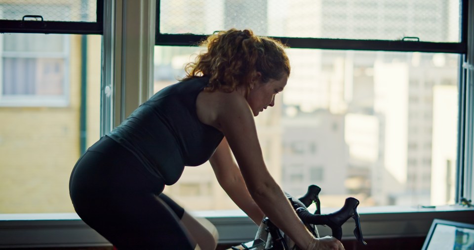 Woman exercising on a stationary bike.