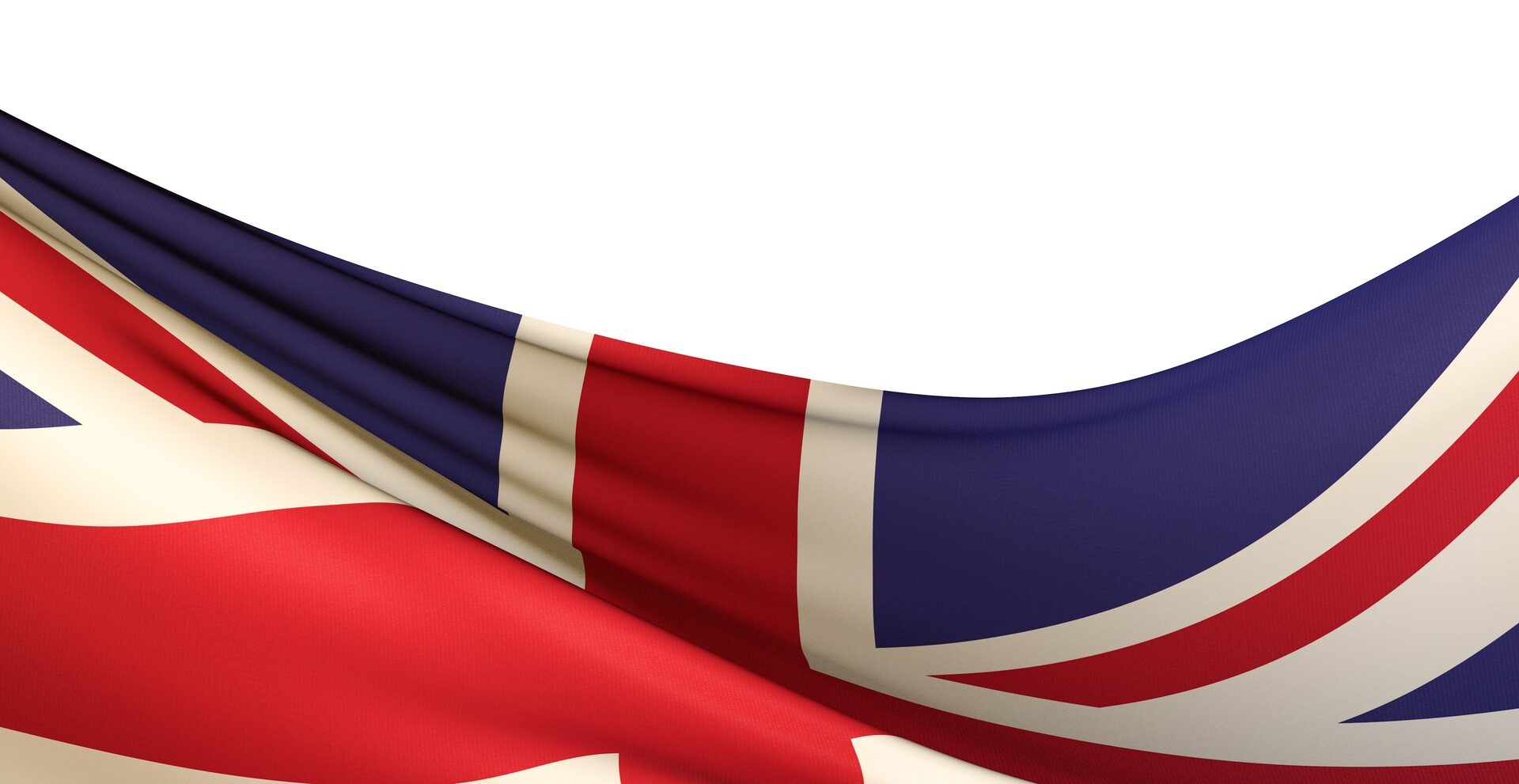 Closeup shot of a wavy flag of the UK under the lights isolated on a white background