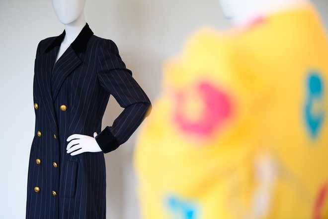 A navy wool pinstripe double-breasted coatdress, designed by Catherine Walker, that Princess Diana was pictured wearing while leaving the Carlyle Hotel in New York in January 1995. It is expected to fetch between $30,000 and $50,000 at auction later this month.