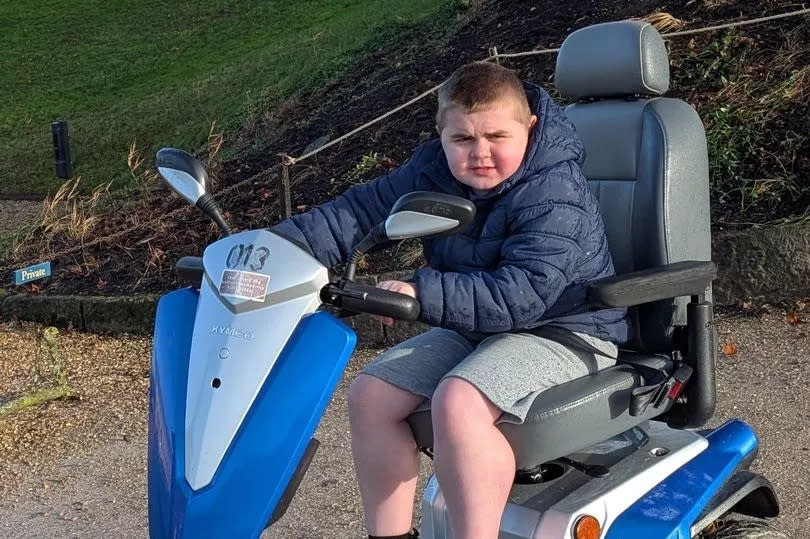 Harry Reid in his motorised scooter