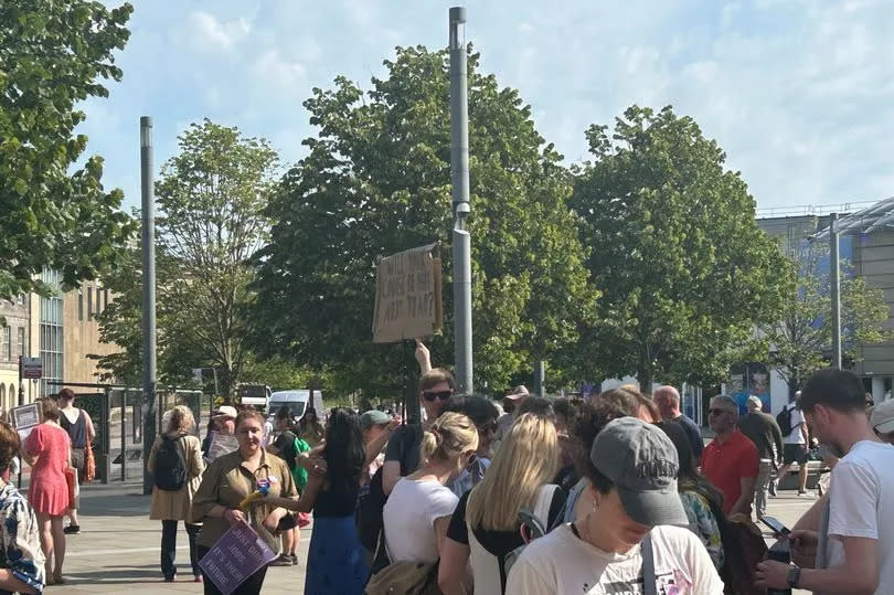 A protestor held a sign that read 'will your course be here next year?'