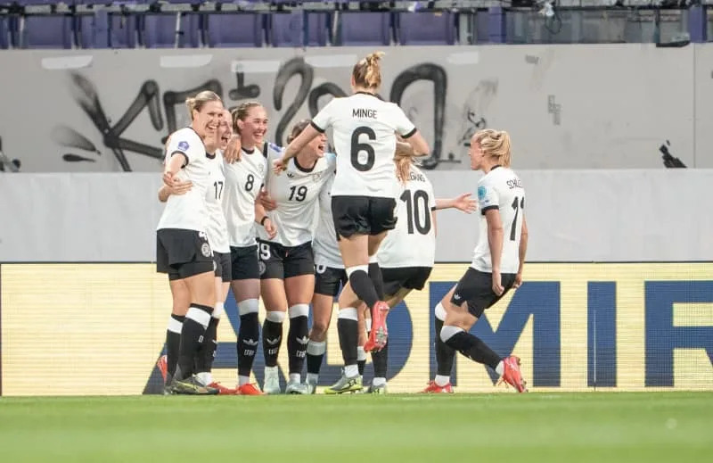 Germany's Sydney Lohmann (3rd L) celebrates scoring her side's first goal with teammates during the Nations League Women soccer match between Austria and Germany at the Generali Arena. Georg Hochmuth/APA/dpa