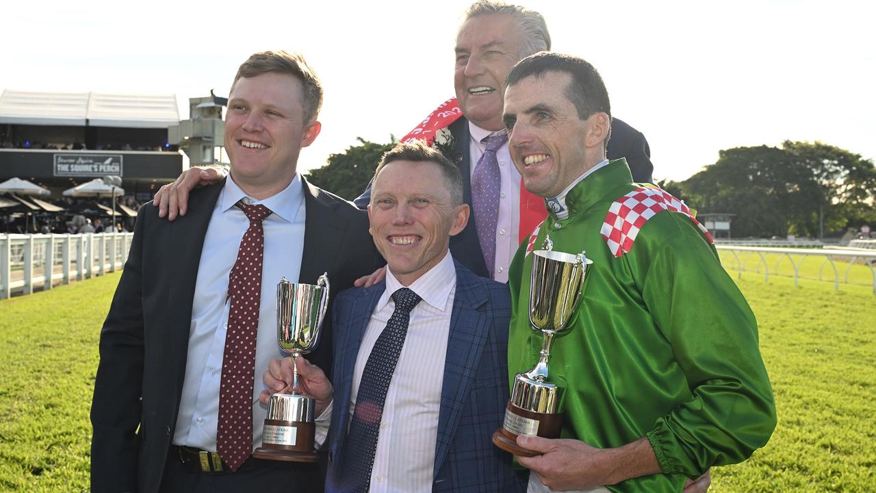 Trainers Corey (left) and Chris Munce (centre), owner Max Whitby (back) and jockey Martin Harley with the spoils of Cool Archie’s victory in the Group 1 JJ Atkins at Eagle Farm. Picture: Grant Peters / Trackside Photography