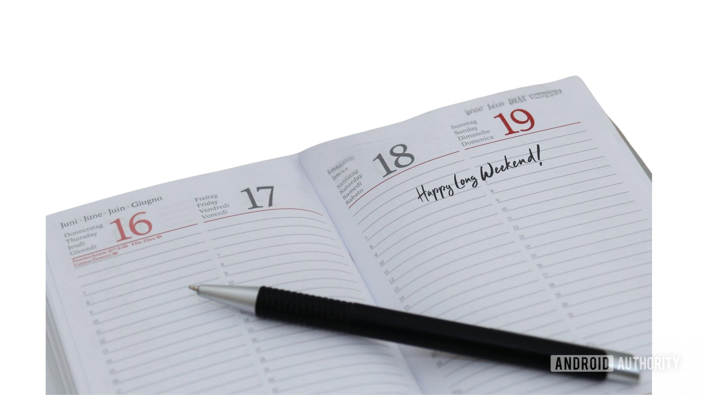  A day planner open June 16 with a black pen on it. 