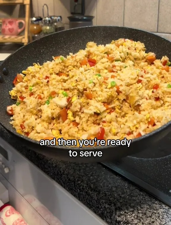 Fried rice in a wok, ready to serve.
