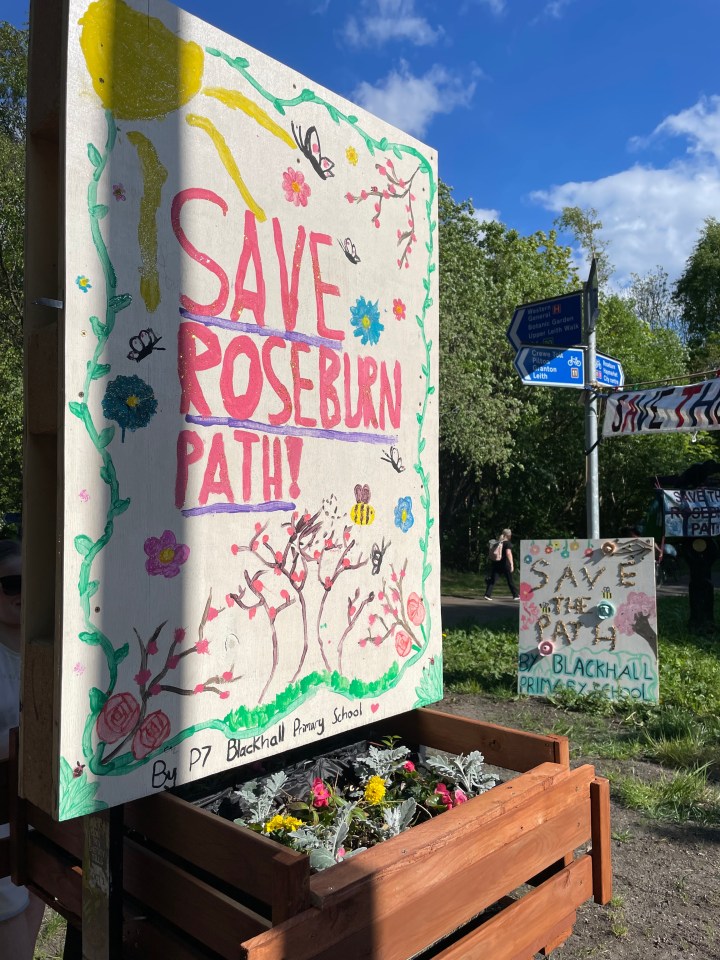 Children's artwork advocating to save a walking and cycling path.