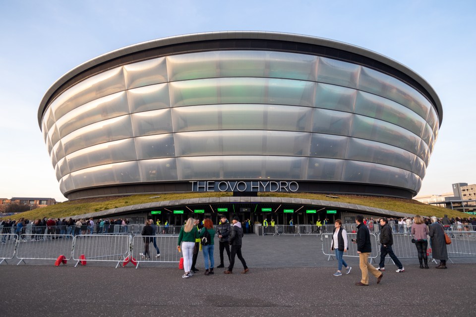 Exterior of The OVO Hydro in Glasgow, Scotland, with people waiting in line.