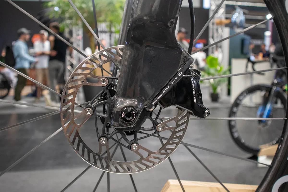 Factor aero bike fork with disc brake caliper.