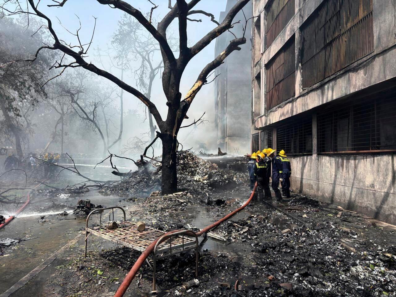 Firefighters work at the site of an airplane that crashed in India's northwestern city of Ahmedabad in Gujarat state, Thursday, June12, 2025. (AP Photo/Ajit Solanki)