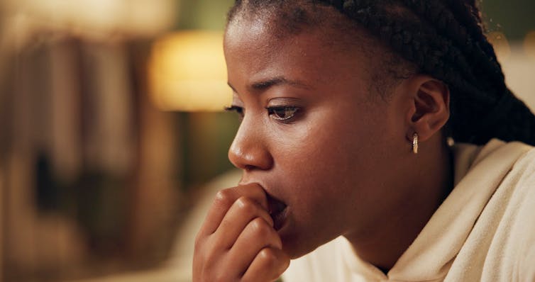 Young woman looking anxious.