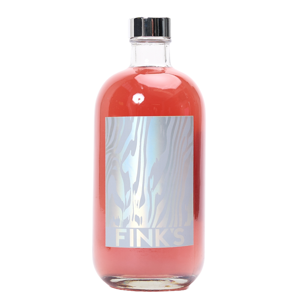 glass bottle with pink liquid and a stylish label