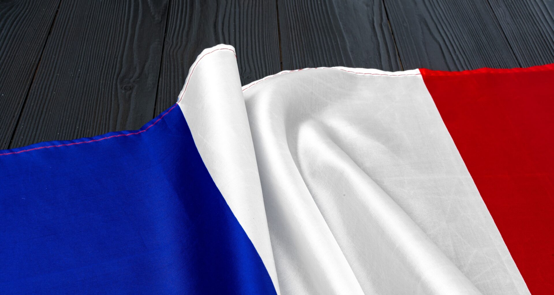 Flag of France on wooden bakground, copy space