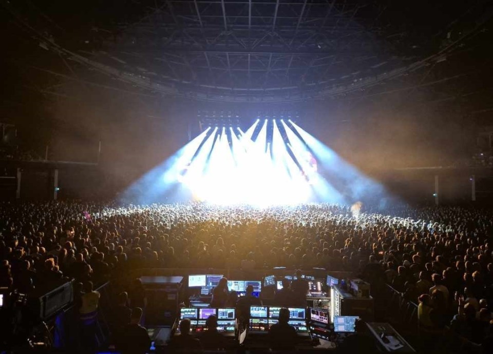Large crowd at a concert in a stadium.
