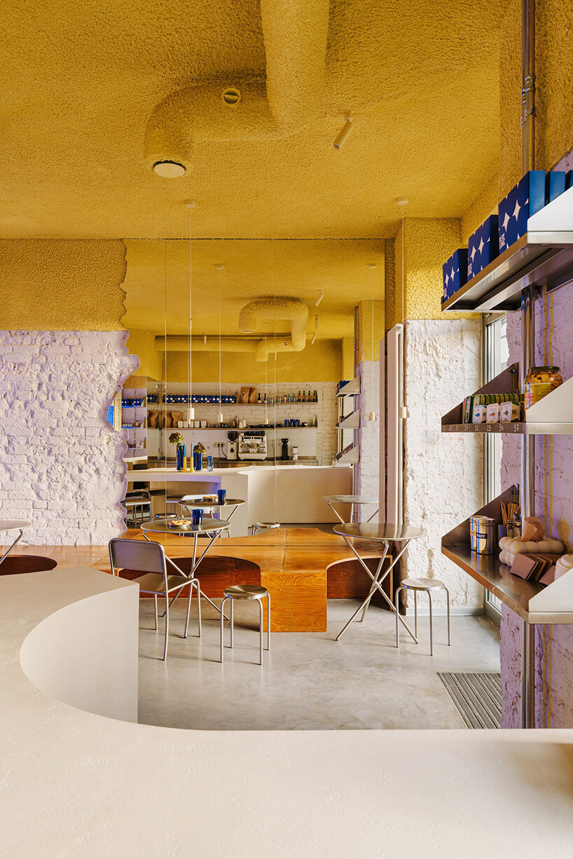 golden ceiling foams above reef-shaped counter in warsaw bakery by znamy się