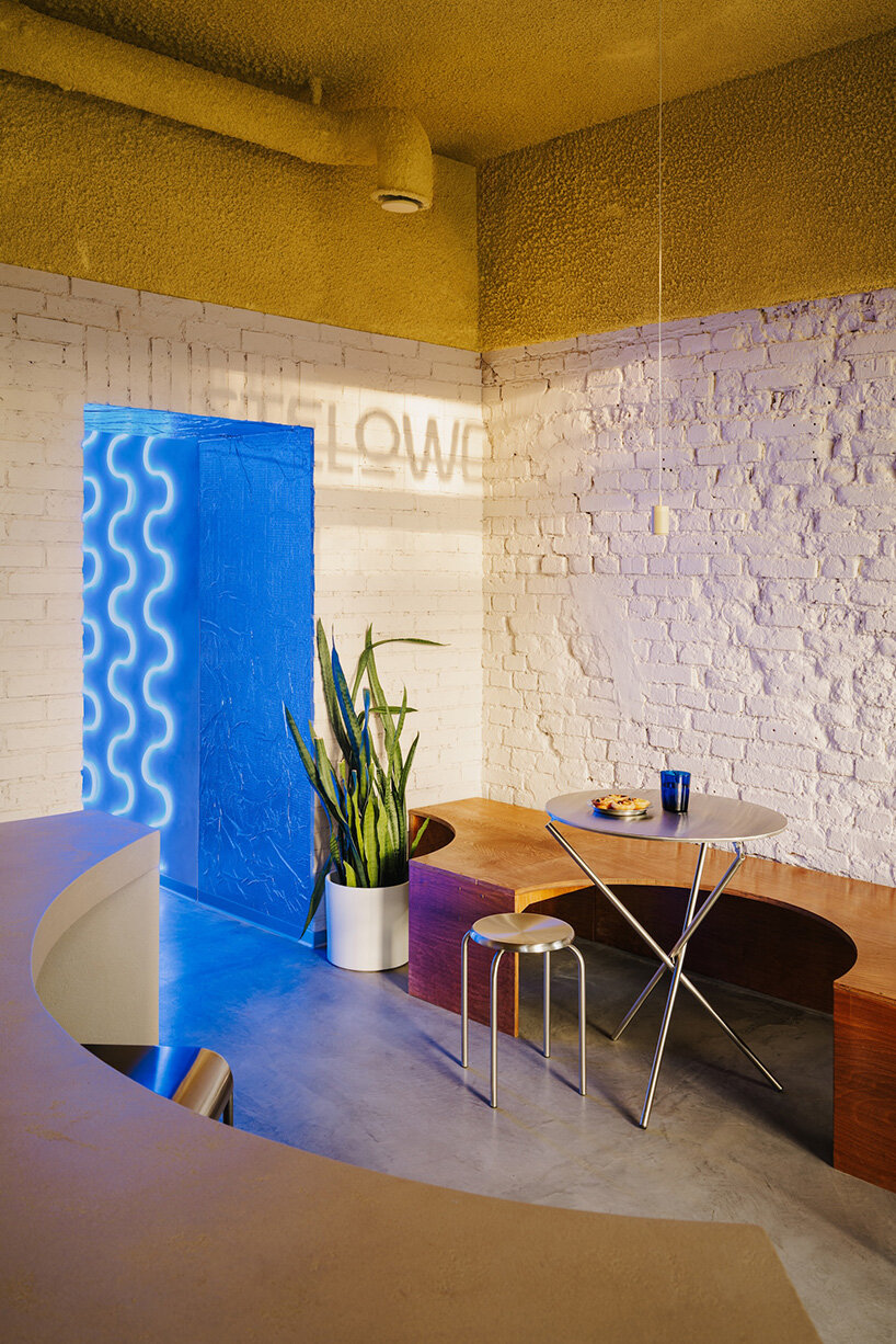 golden ceiling foams above reef-shaped counter in warsaw bakery by znamy się