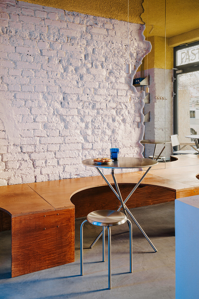 golden ceiling foams above reef-shaped counter in warsaw bakery by znamy się