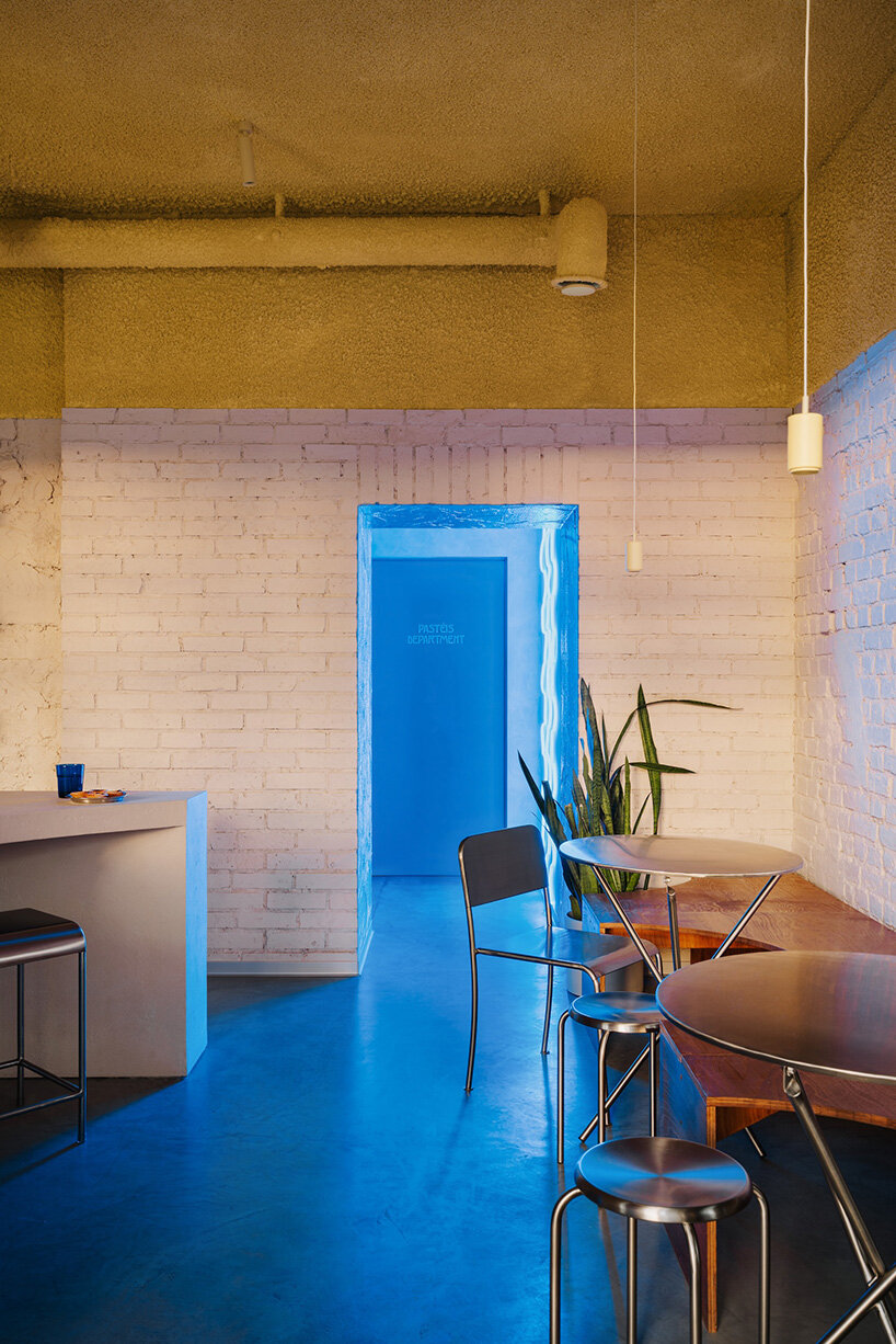 golden ceiling foams above reef-shaped counter in warsaw bakery by znamy się