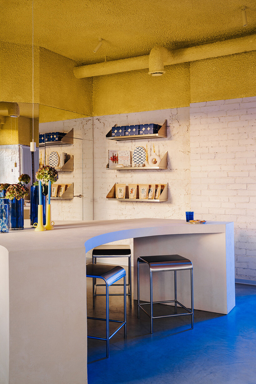 golden ceiling foams above reef-shaped counter in warsaw bakery by znamy się