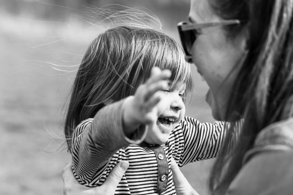 Black and white photo of a woman holding a young child.