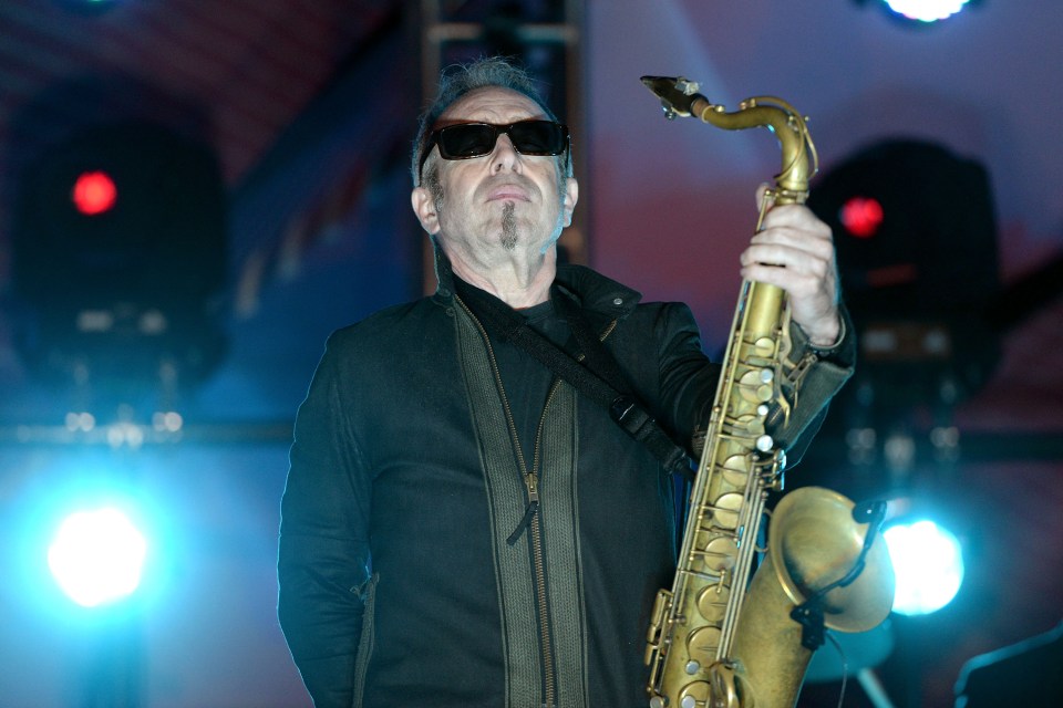 Mars Williams of The Psychedelic Furs playing saxophone onstage.