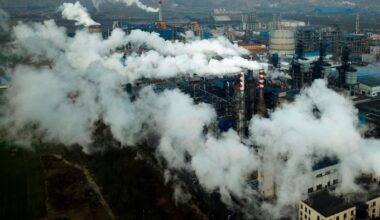 An aerial view of smoke and steam rising from a coal processing plant in Hejin, China