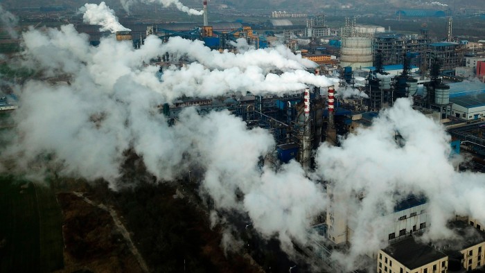 An aerial view of smoke and steam rising from a coal processing plant in Hejin, China
