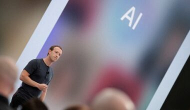Mark Zuckerberg delivers a speech, as the letters AI for artificial intelligence appear on a screen